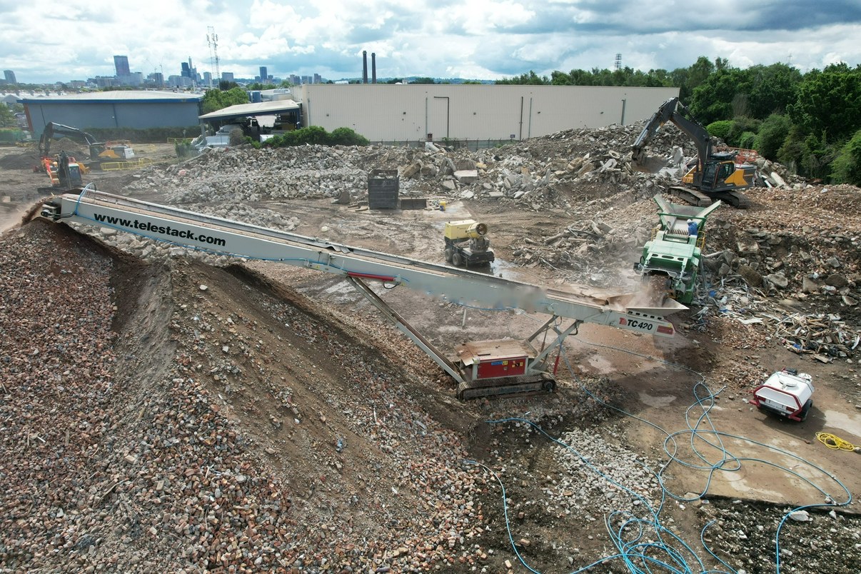 Telestack TC420 tracked stacker building a stockpile behind a crusher